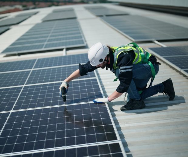 Professional worker installing solar panels on the roof. engineer working on checking equipment in solar power plant, Pure energy, Renewable energy.
